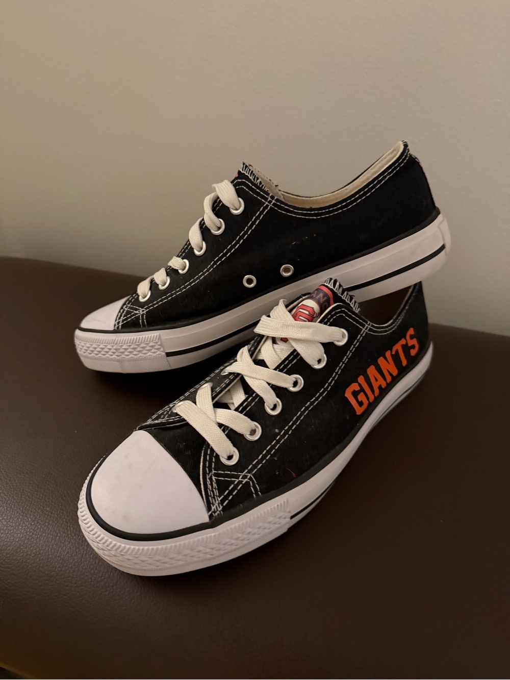Black Low-Top Athletic Sneakers with Orange 'GIANTS' Accent